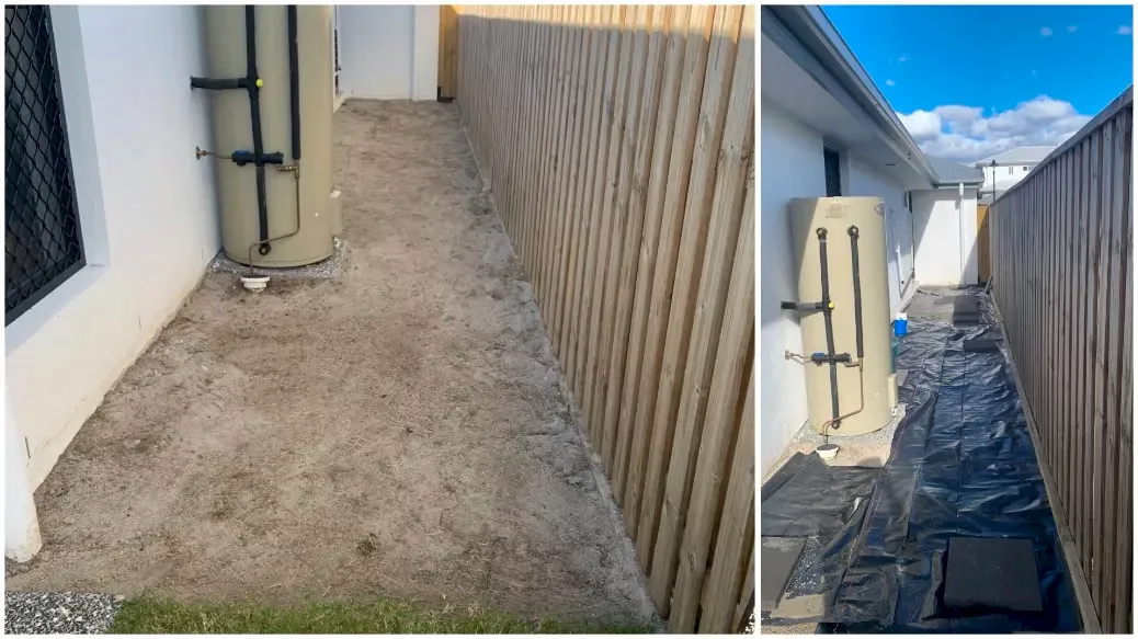 Side yard beside house prepped with sand base and weed mat for paving install